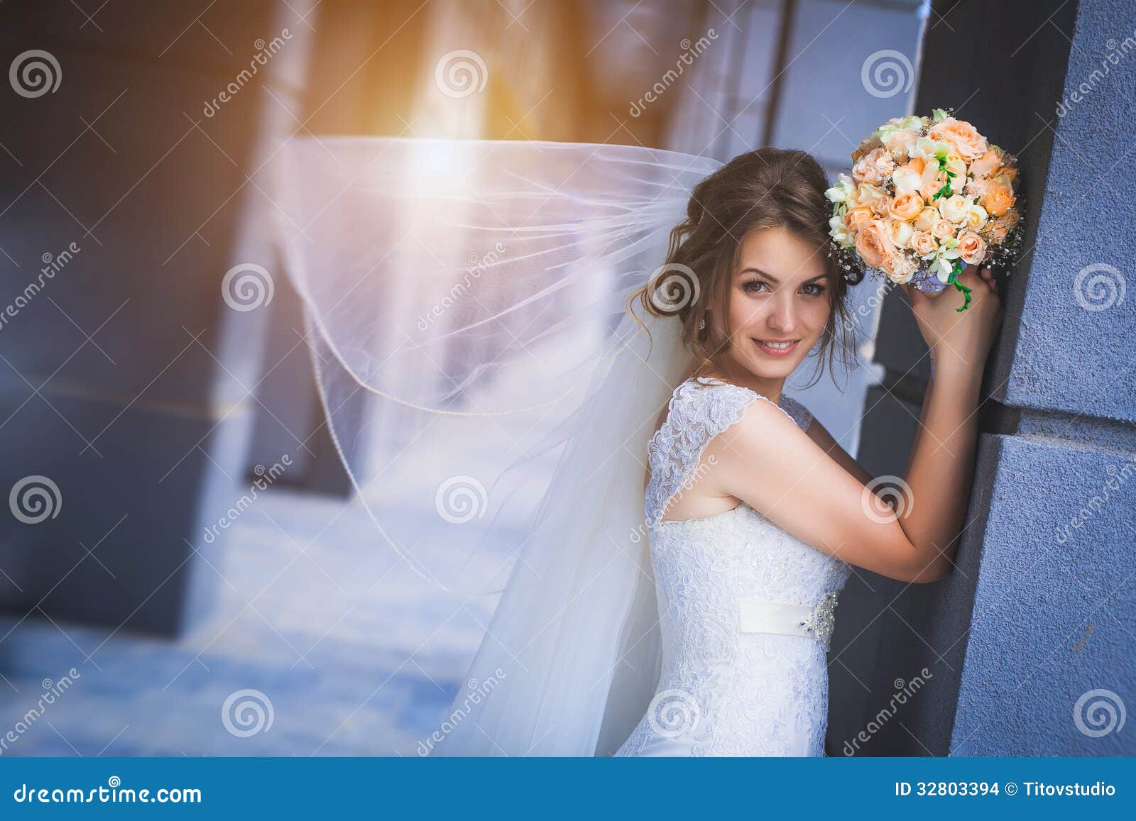 Bride Against a Blue Modern Building Background Stock Photo - Image of ...