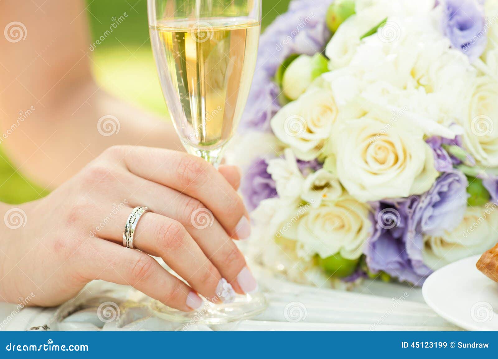 Bride with champagne and flowers