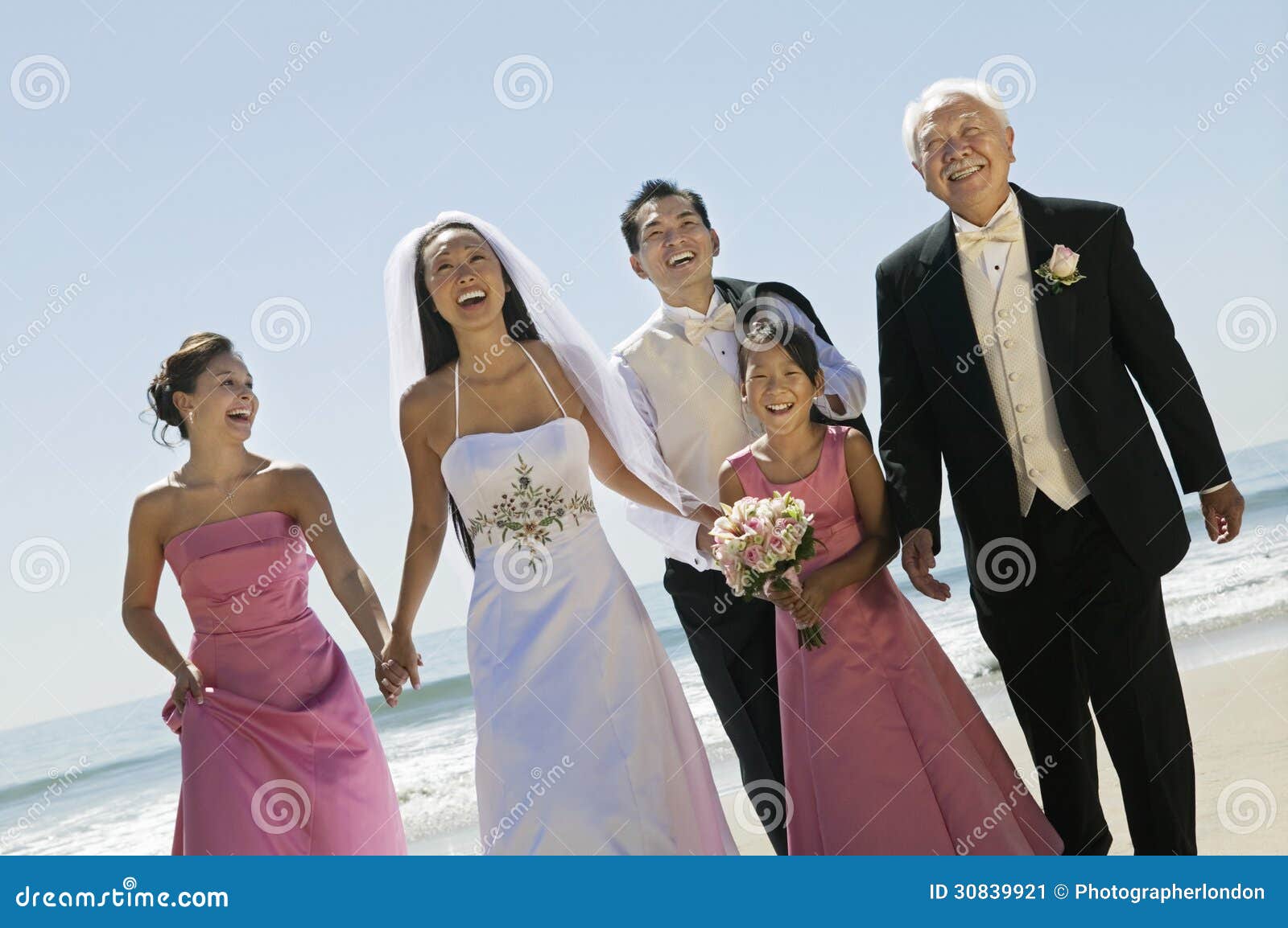Bride And Groom With Family On Beach (portrait) Stock