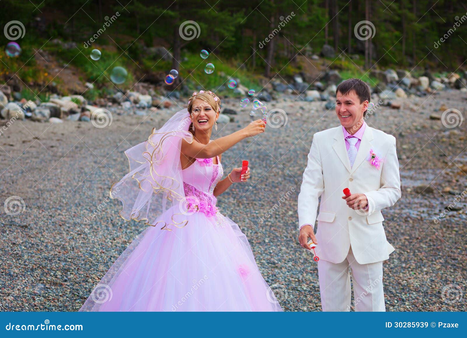 Bride and Groom Having Fun with Soap Bubbles Stock Image Image of