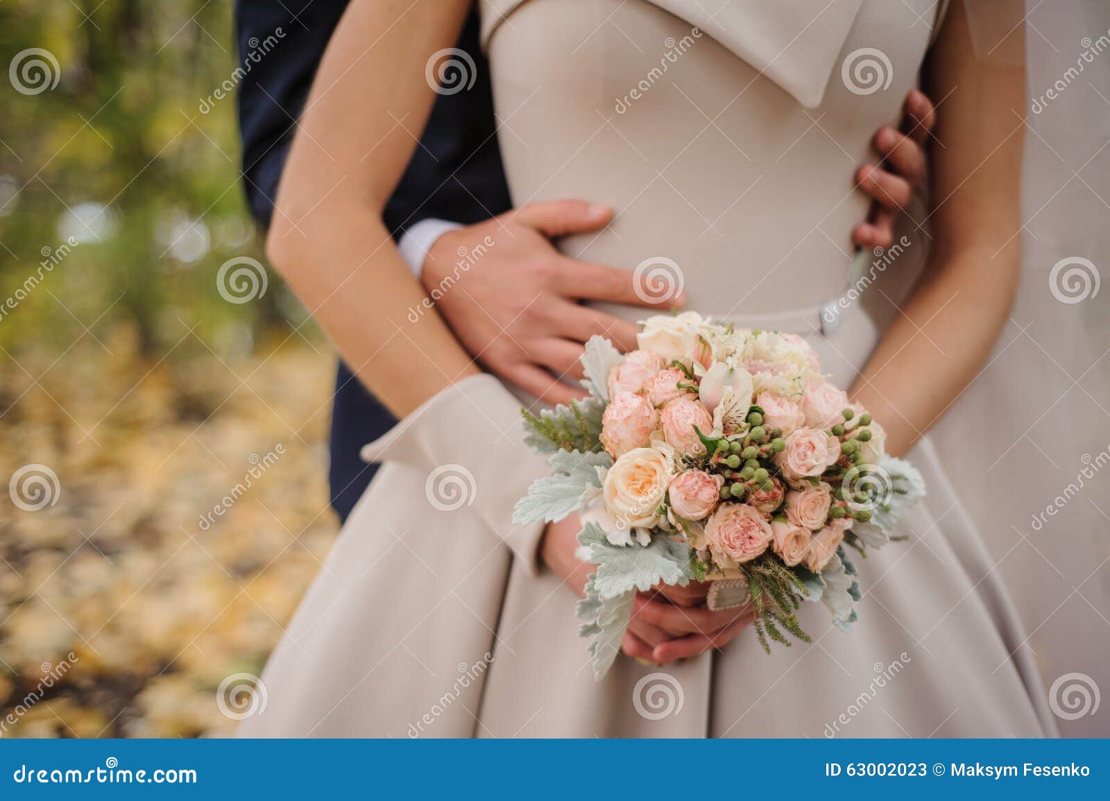 Bride and Groom Holding Bouquet Stock Image - Image of beautiful ...