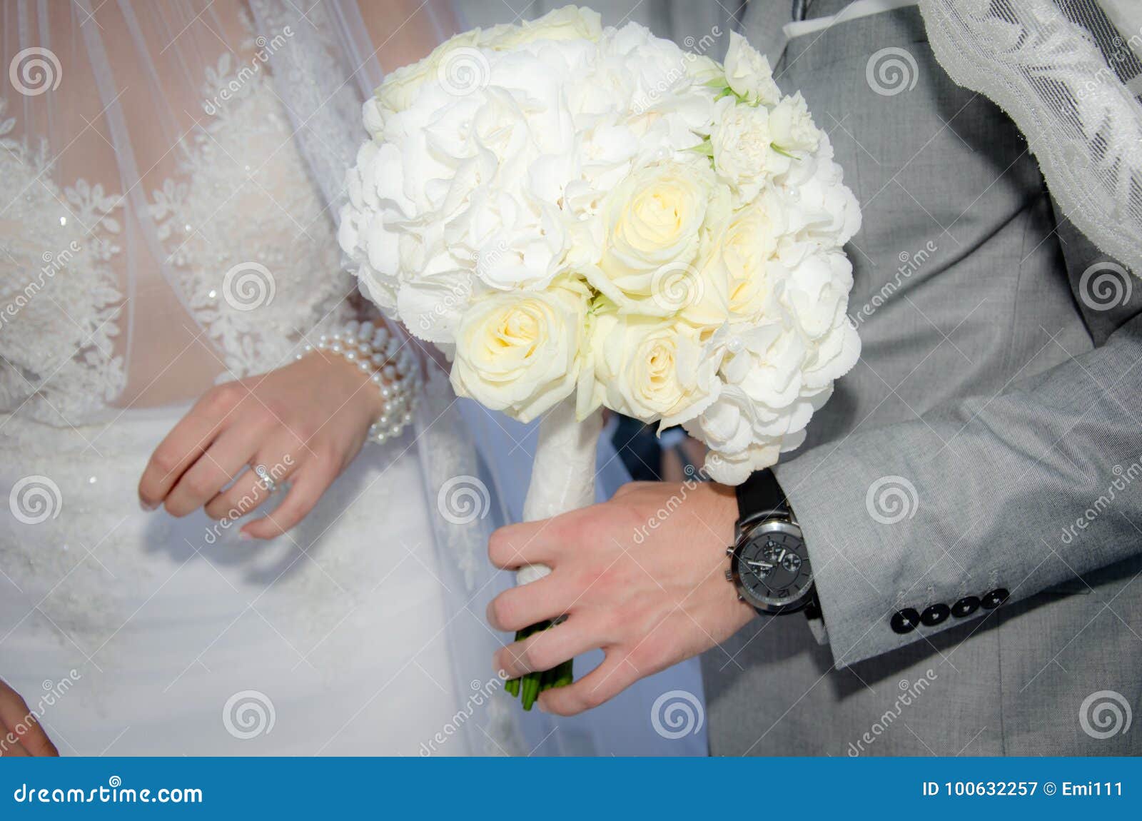 Bride and Groom Holding Bouquet of Roses Stock Image - Image of holding ...
