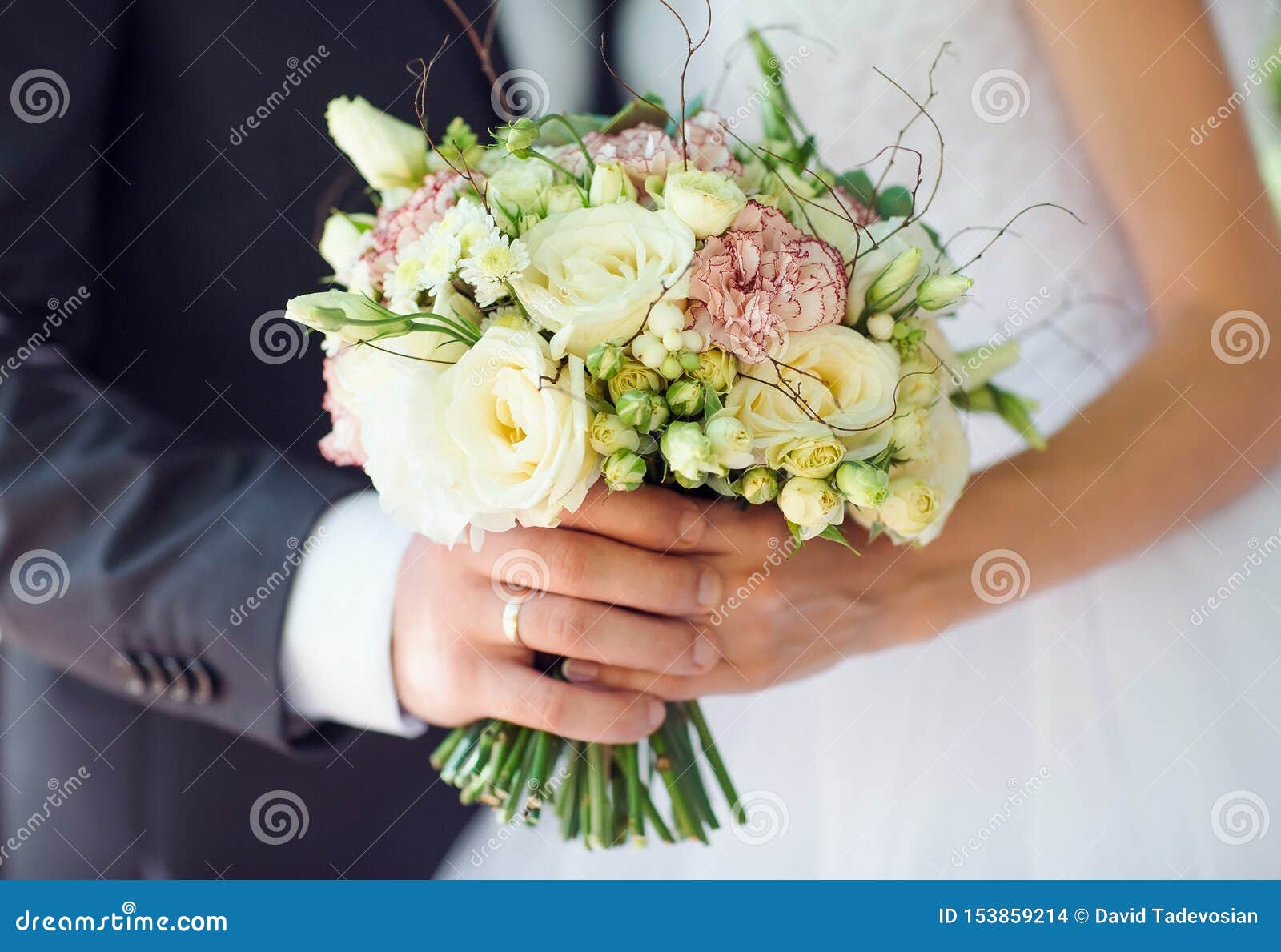 Bride and Groom Holding Wedding Bouquet Hand in Hand. Stock Photo ...