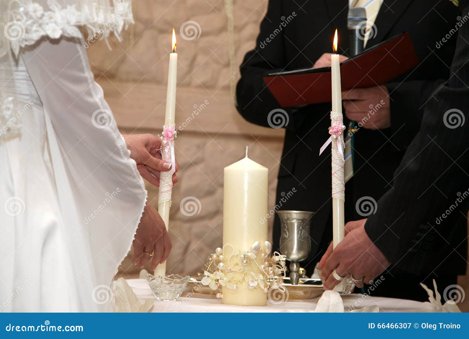 Bride and Groom Light the Wedding Candle at the Ceremony Stock Image