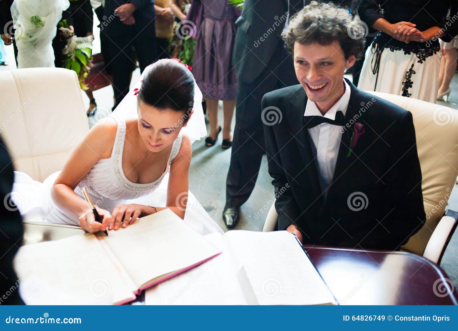 bride and groom signing registry