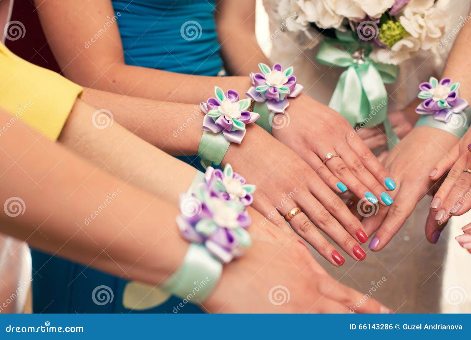Flower bracelets with red roses and silk ribbons. Bridesmaids in red  dresses, american style wedding Stock Photo by olegbreslavtsev