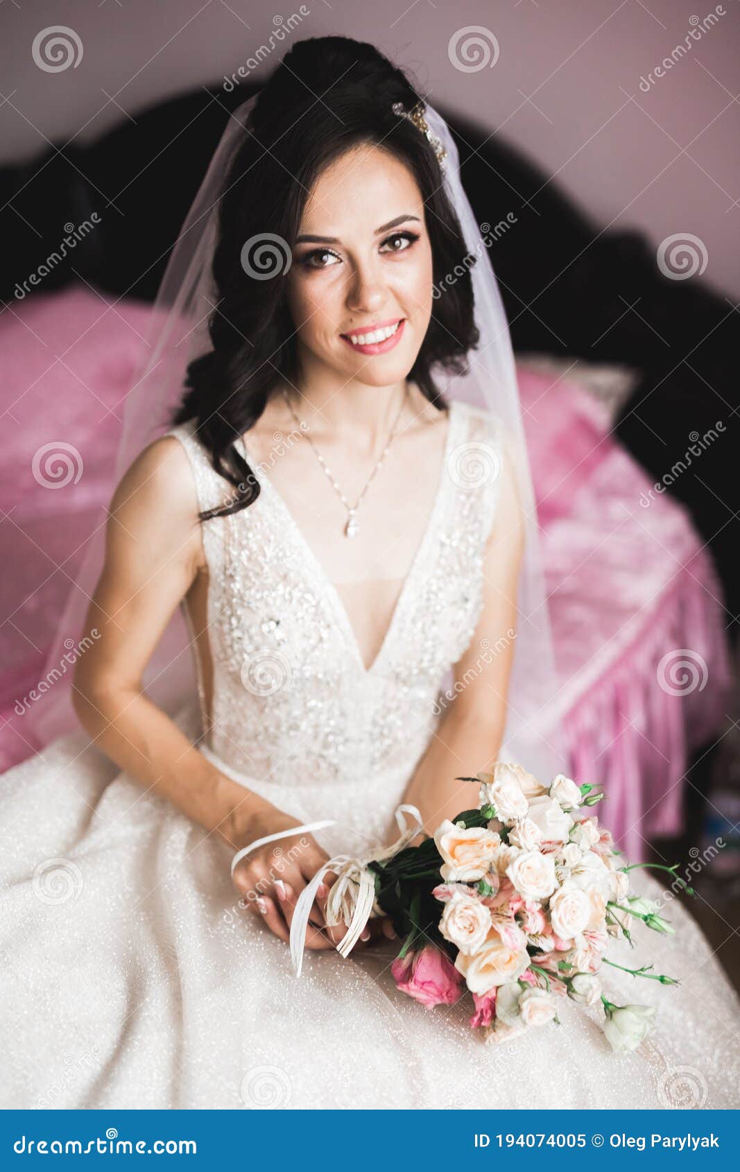 Bride Holding Big and Beautiful Wedding Bouquet with Flowers Stock