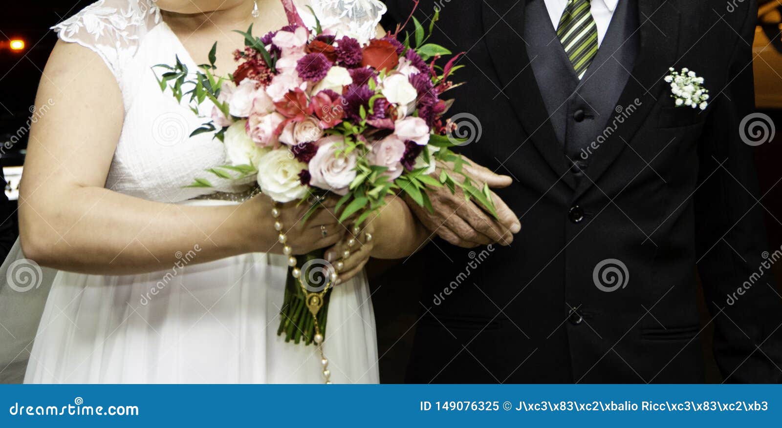 Bride Holding Bouquet of Flowers with Her Father at the Entrance of ...