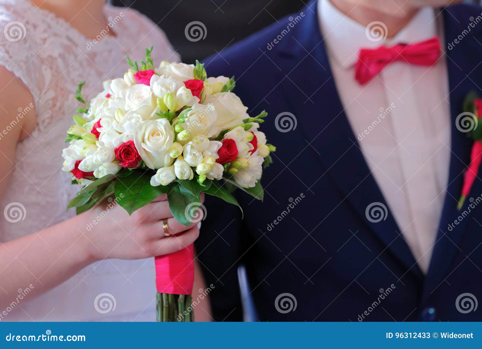 Bride Holding Colorful Flowers Bouquet with Her Hands on Wedding Stock ...