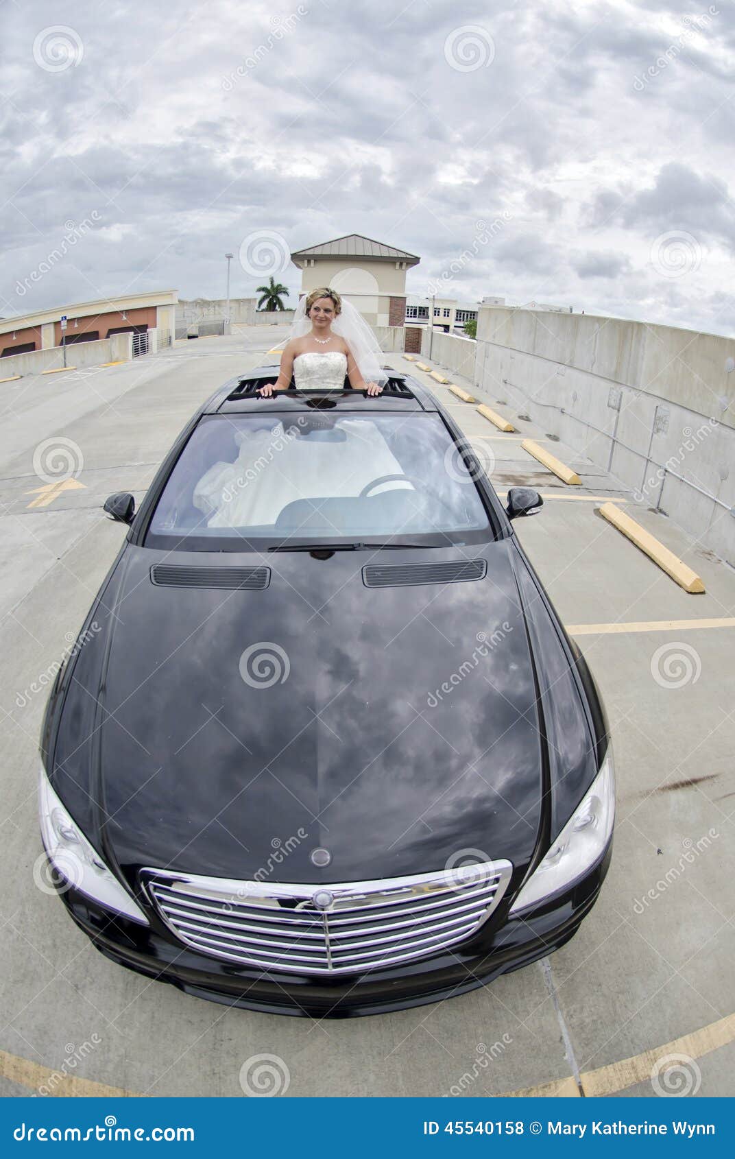 bride in limousine sunroof