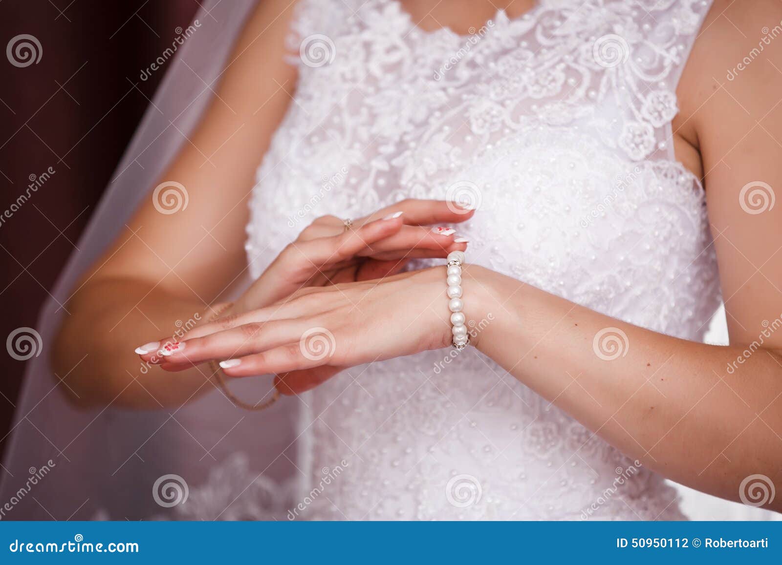 Bride Puts on Pearl Bracelet. Stock Photo Image of fashion, accessory