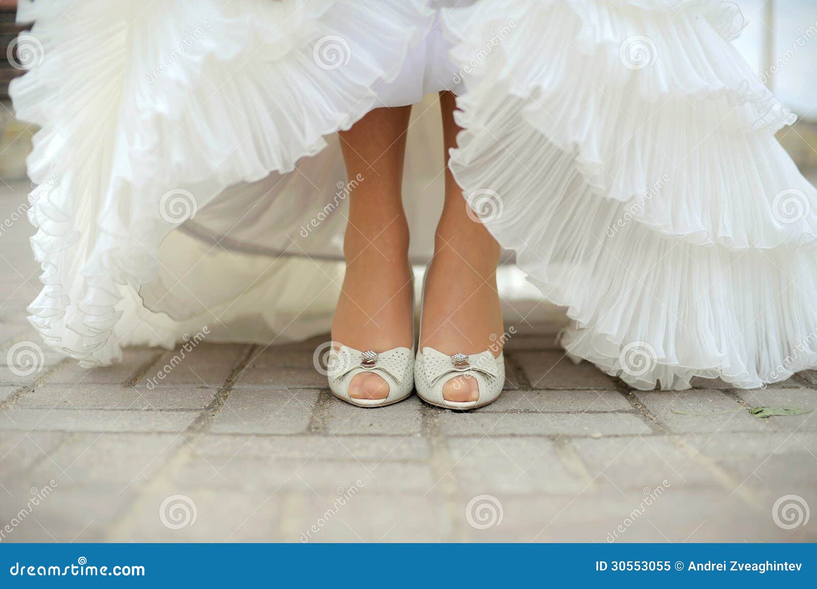 Bride Showing Her Shoes stock image. Image of beautiful - 30553055
