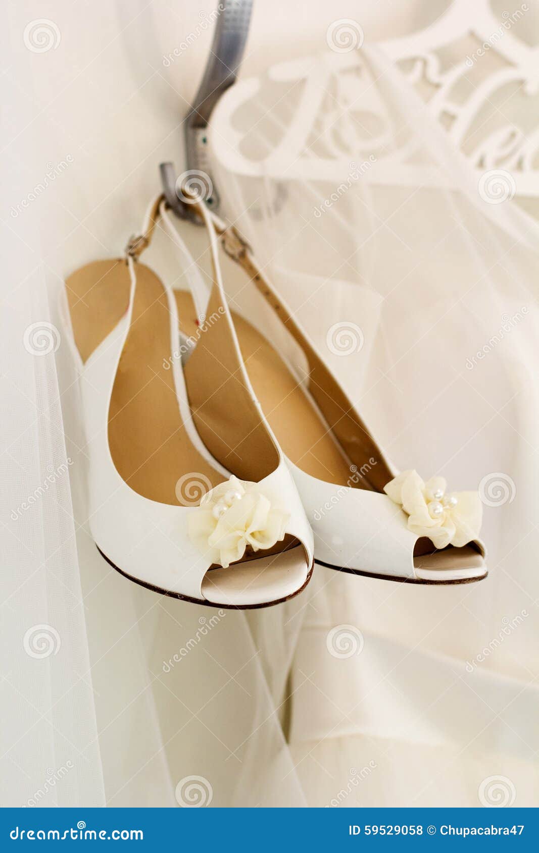 Bride Wedding Shoes is Hanging on the Hanger Stock Photo - Image of ...