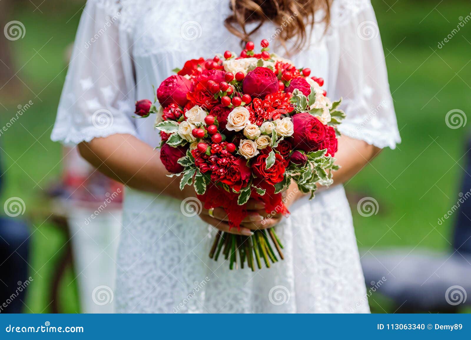 Bride In White Dress Holding In Hands Delicate Expensive Trendy Bridal Wedding Bouquet Of Flowers In Marsala And Red Colors Clo Stock Photo Image Of Close Classic 113063340