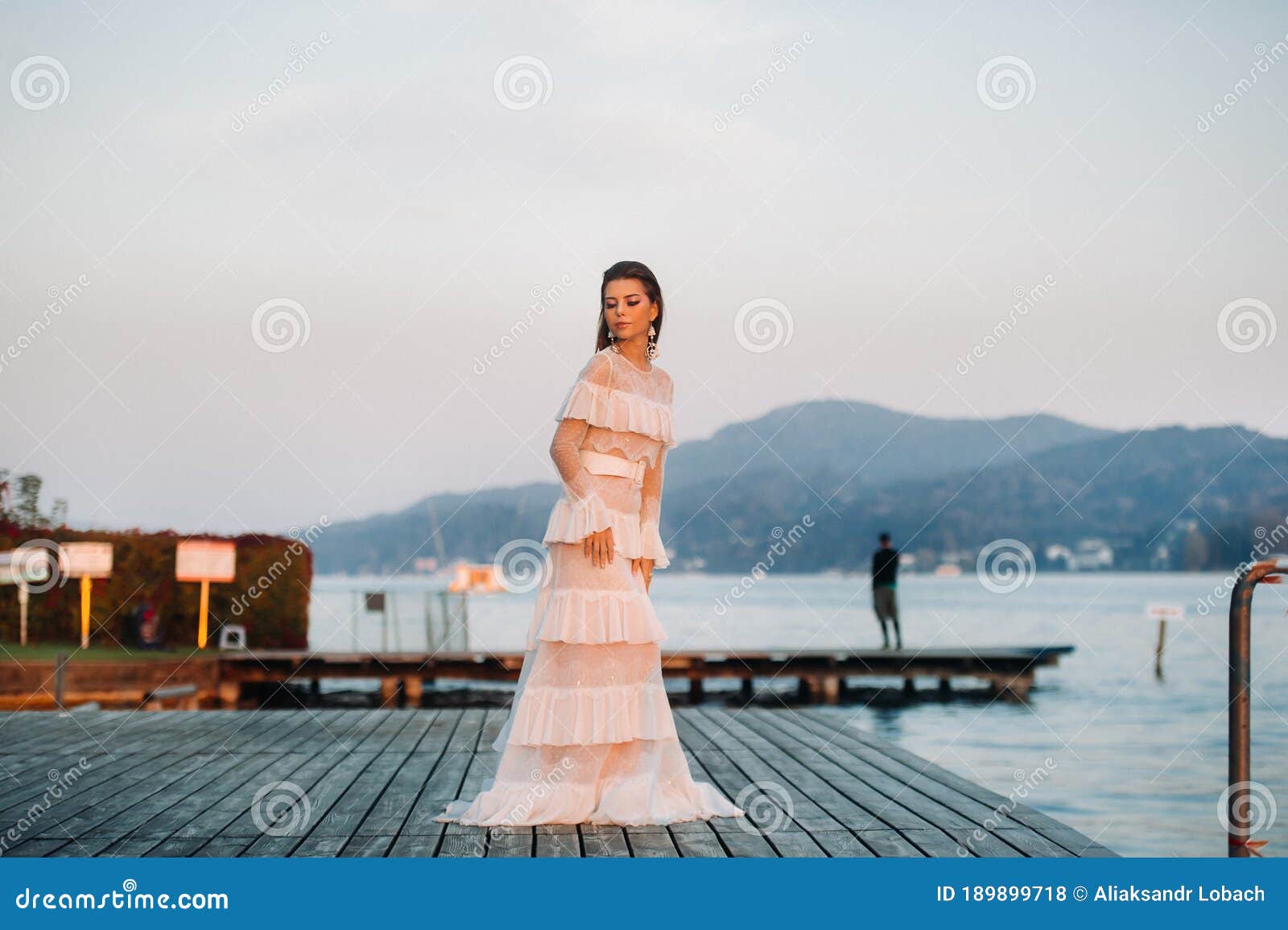 bride in white wedding dress in the old town of velden am w rthersee.model in a wedding dress in austria.alps