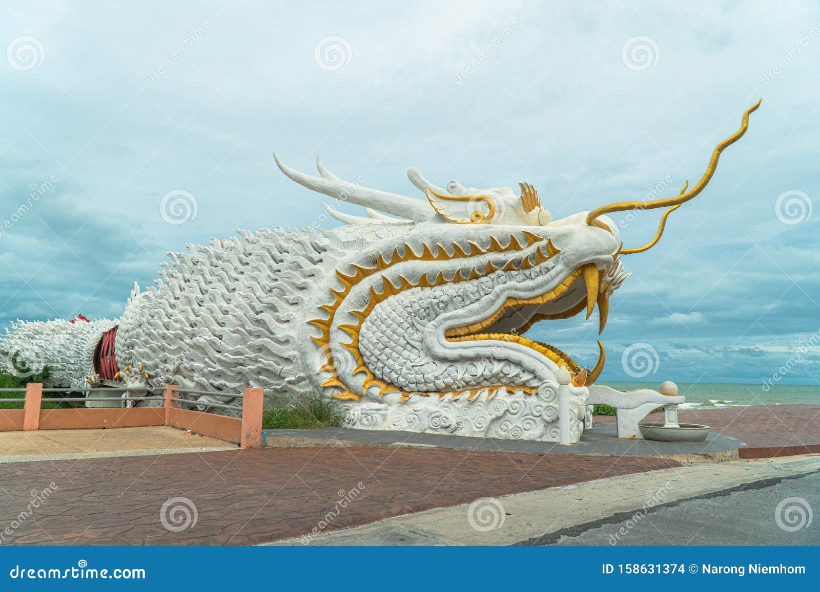 bridge across canal in dragon sculpture at payoo