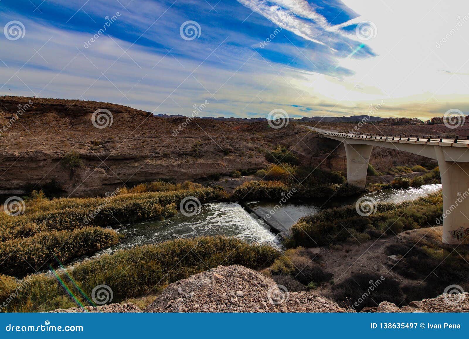bridge over river in arizona desert.
