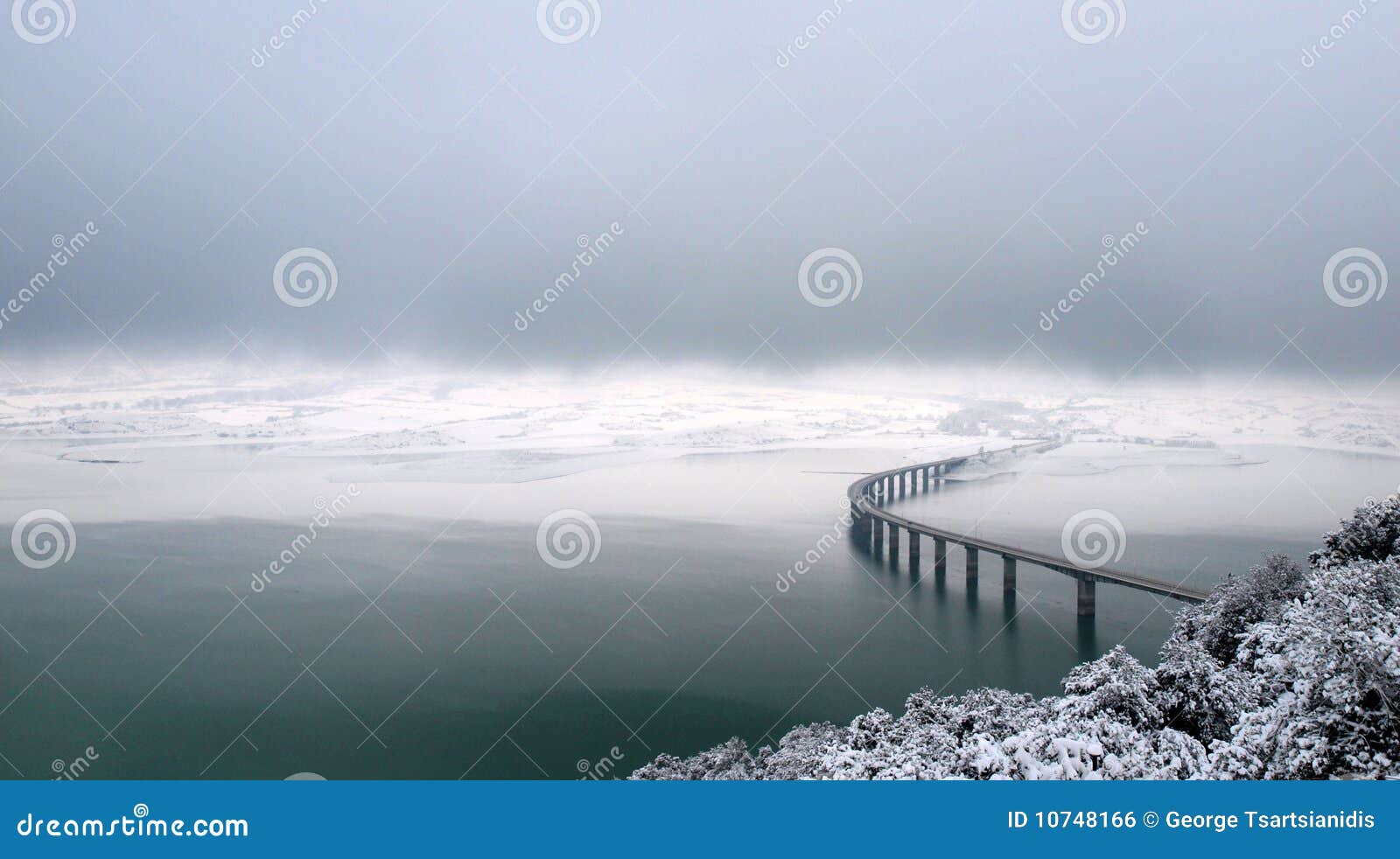 bridge over wintry lake