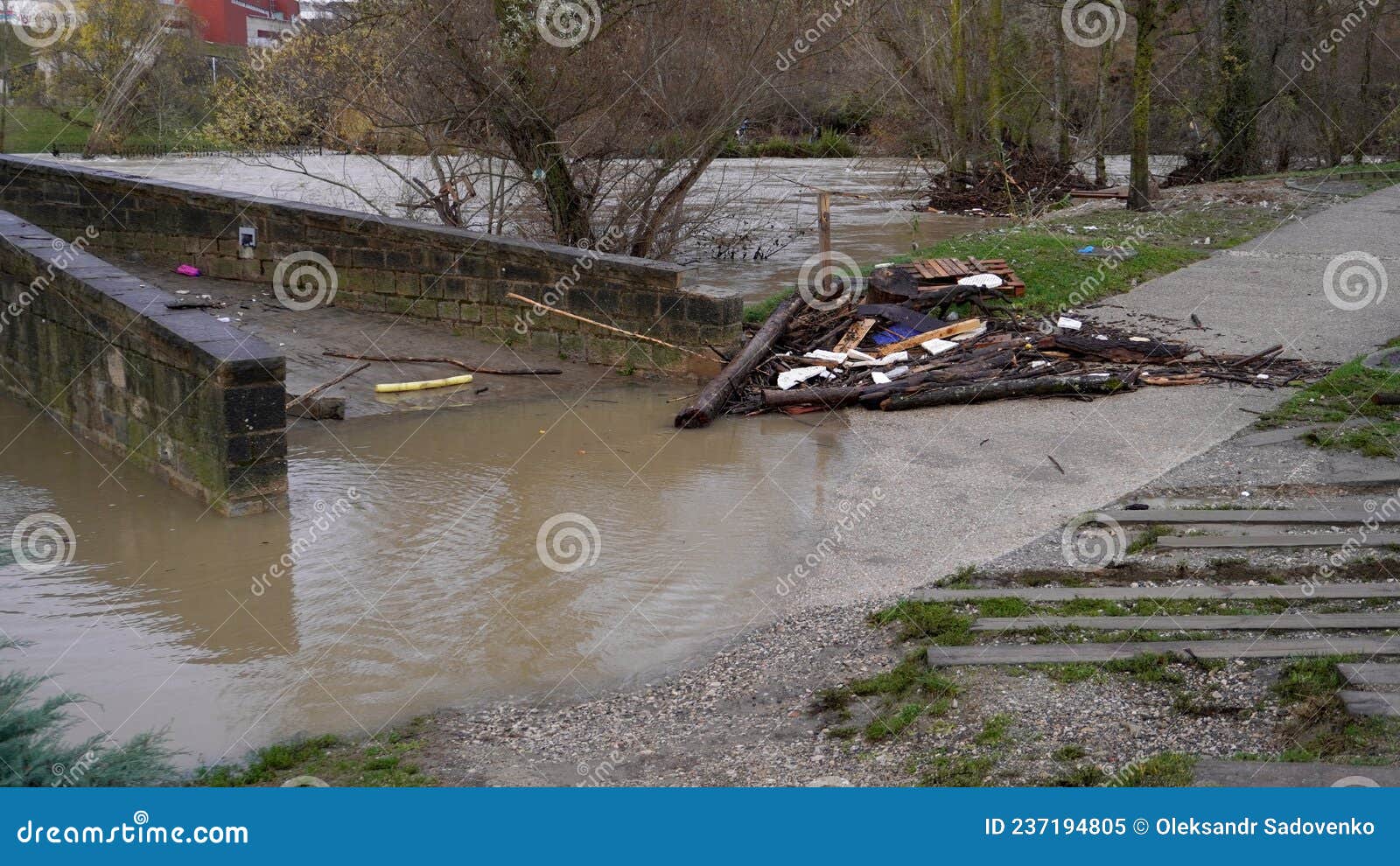 the bridge was flooded with water and filled with logs that carried the current.