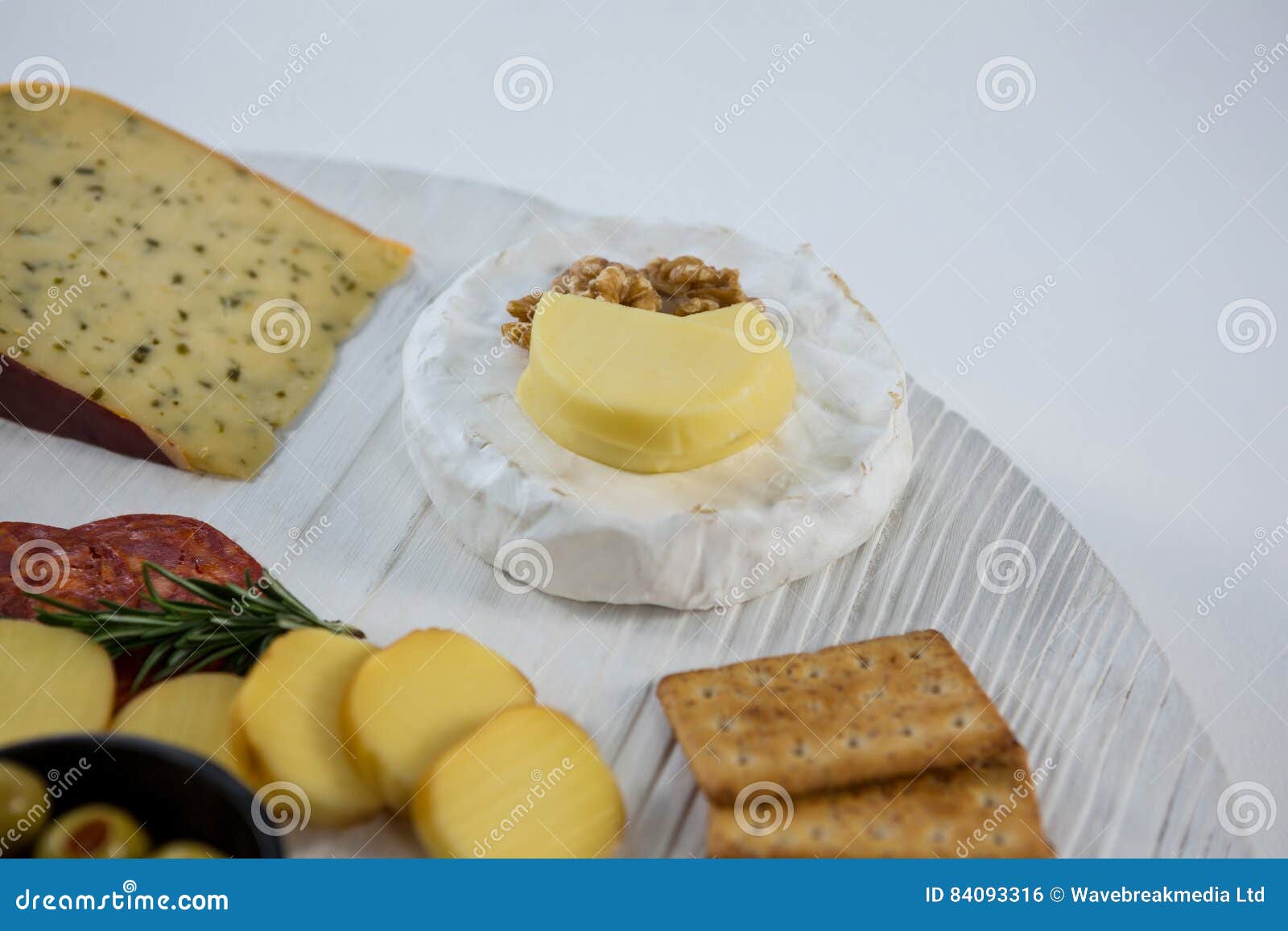 Brie Cheese with Crackers and Ingredients on Wooden Board Stock Photo