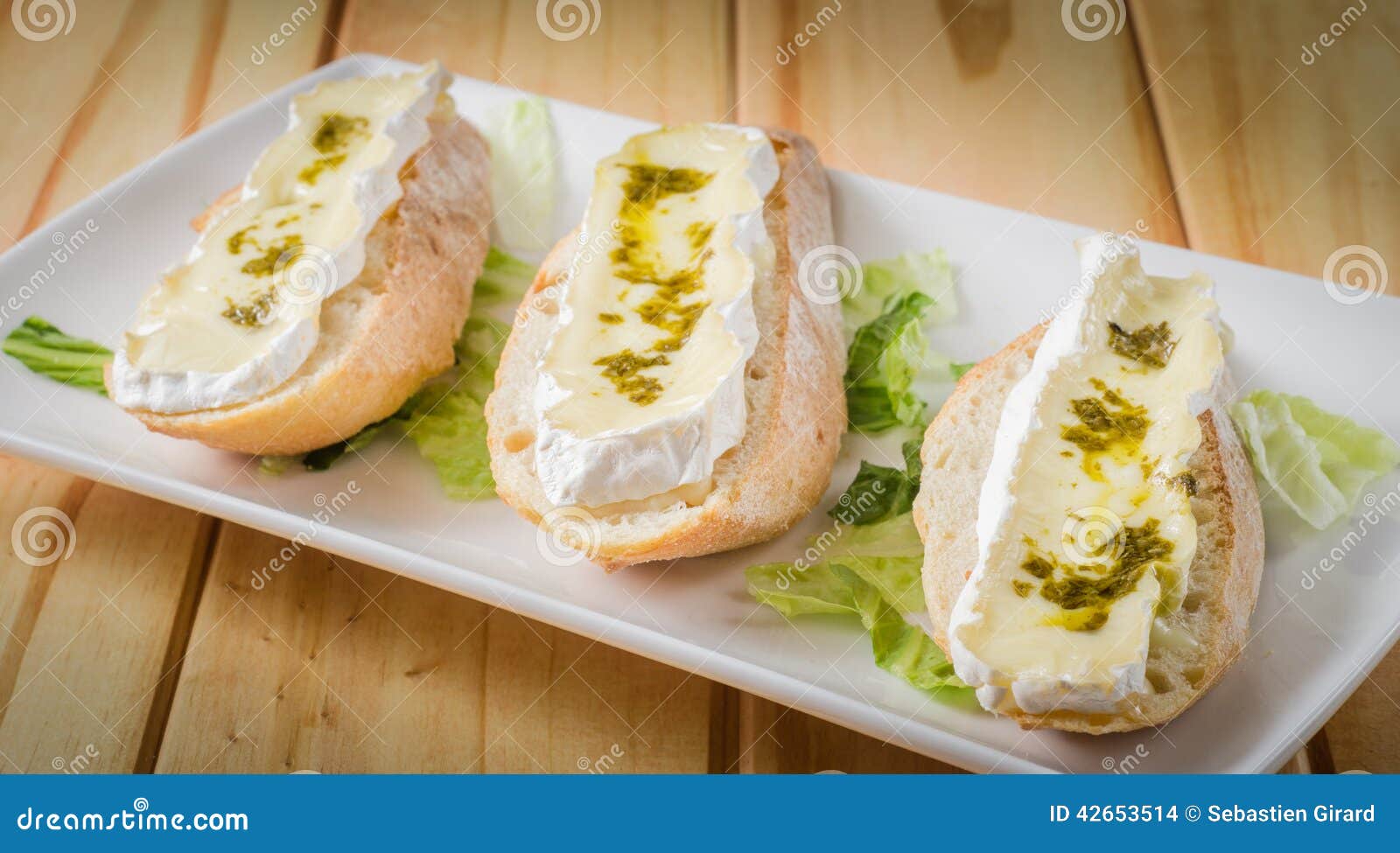 Brie cheese and pesto stock photo. Image of plate, milk 42653514