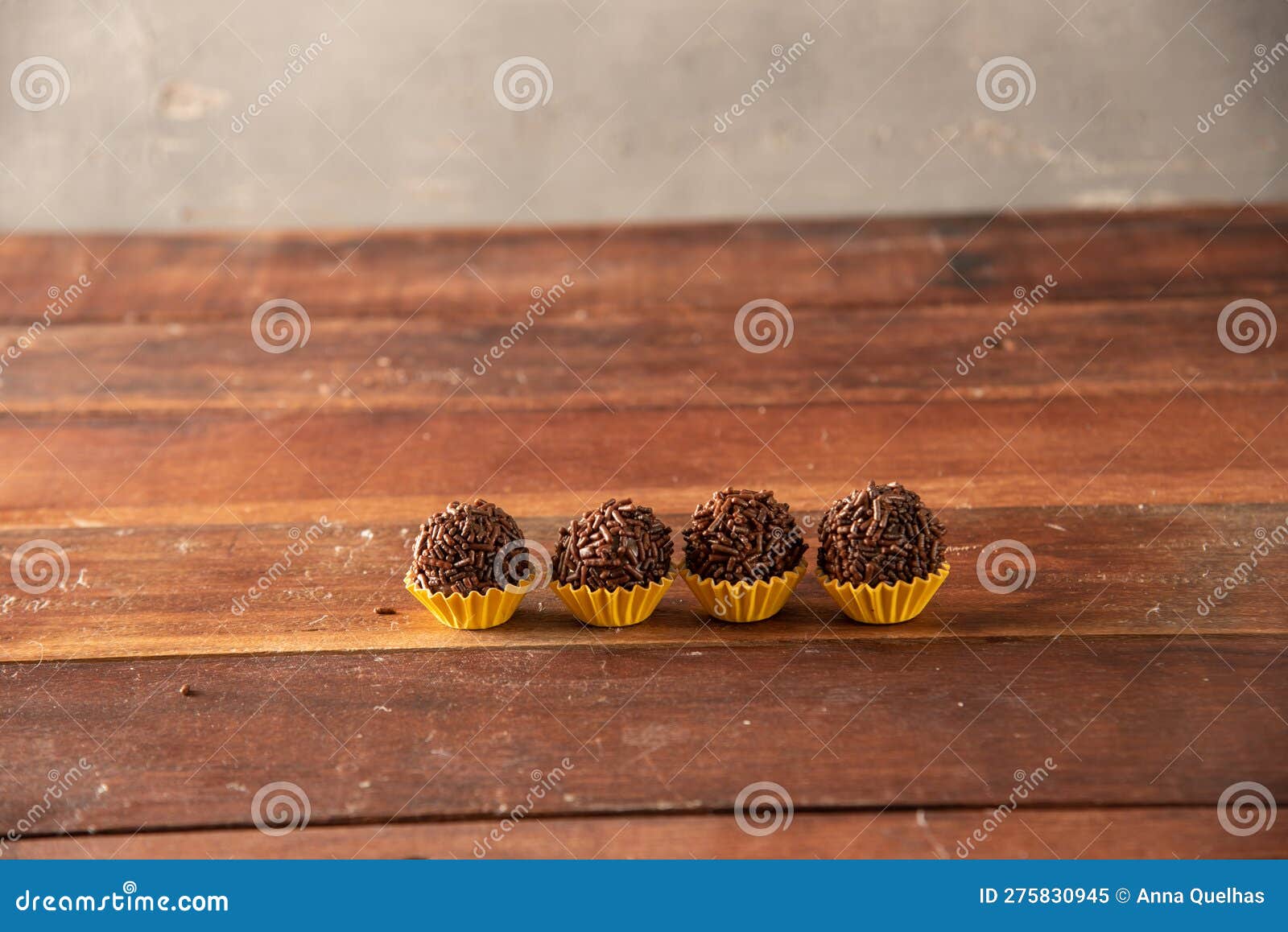 brigadeiro (brigadeiro) traditional brazilian sweet. lined up on a wooden board