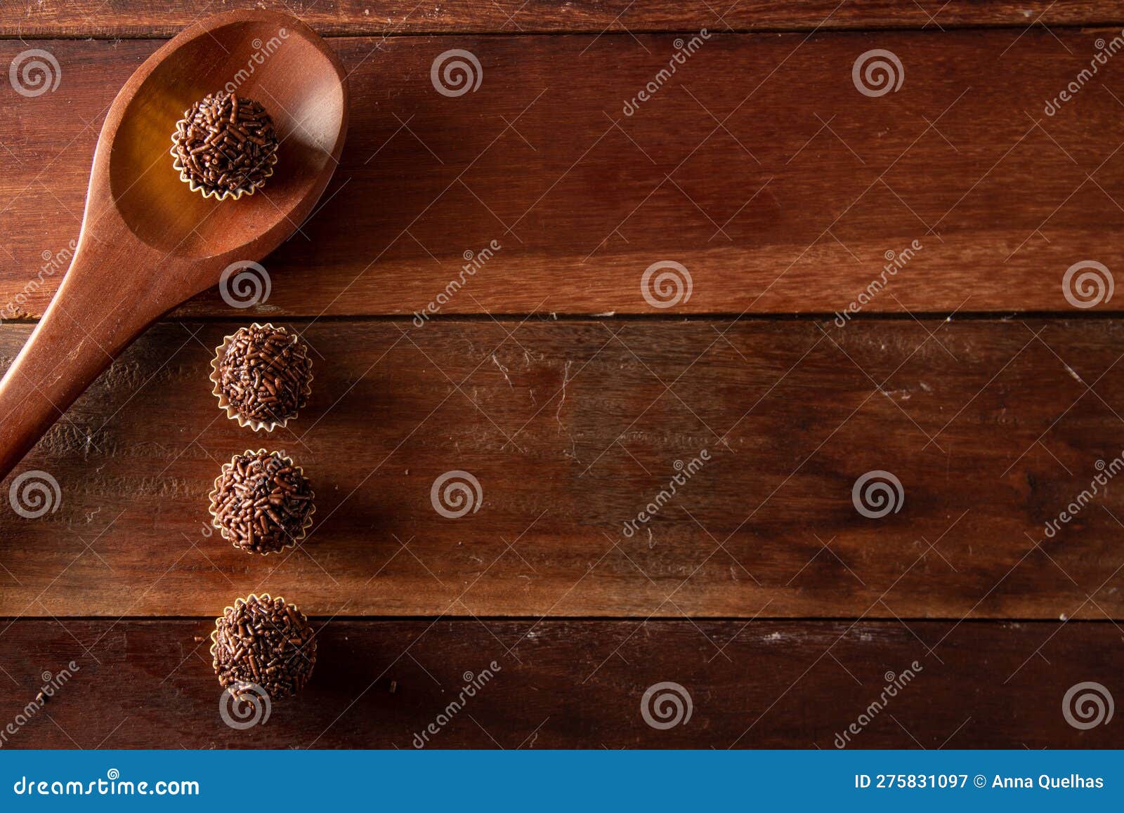 brigadeiro (brigadeiro) traditional brazilian sweet. lined up on a wooden board