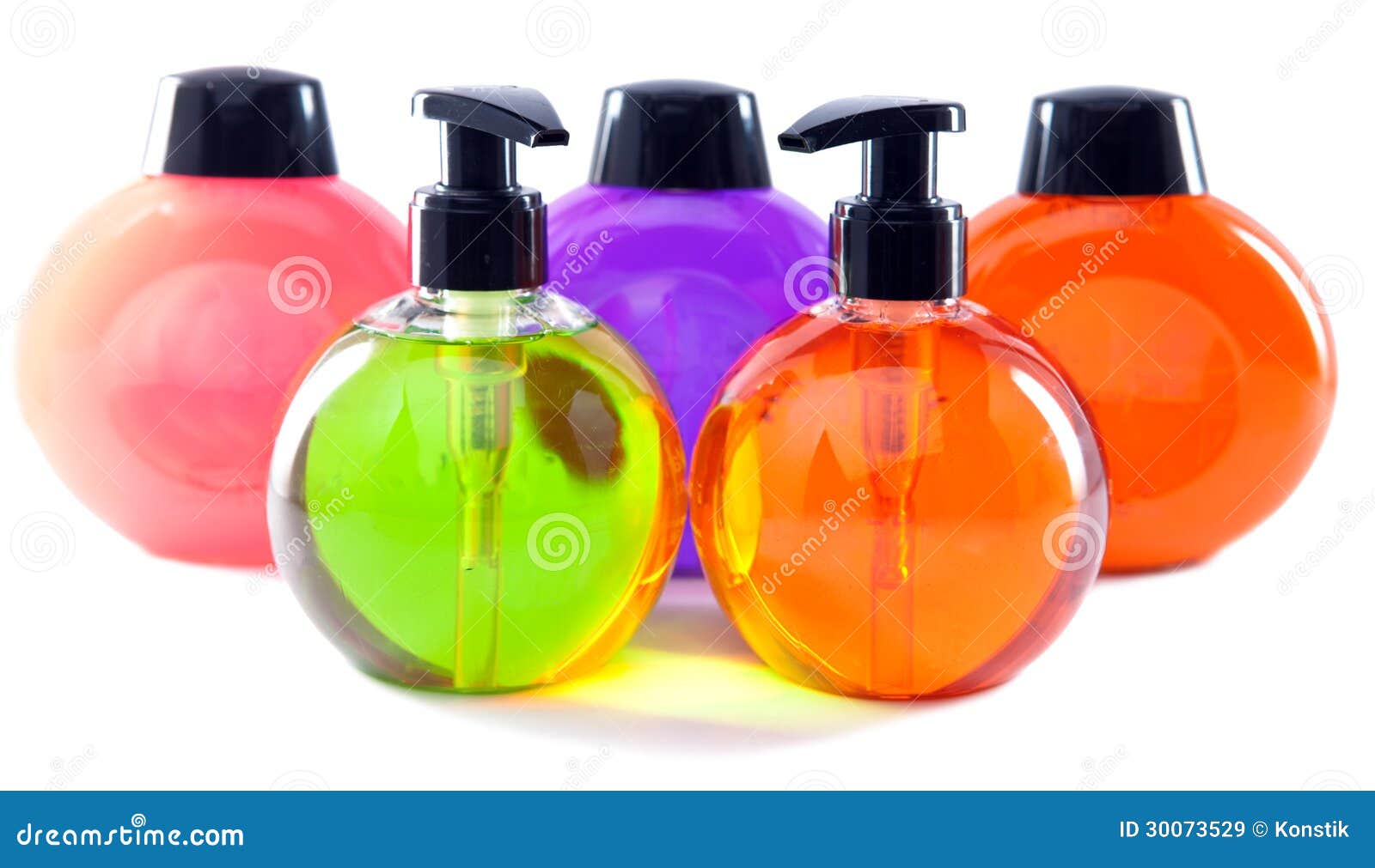 Five Plastic Bottles of Various Color with Liquid Soap Stock Image