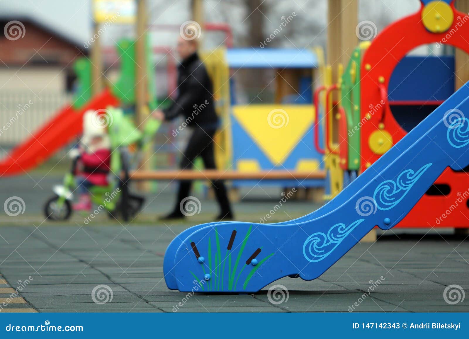 Bright Colorful Slides On Nursery Playground With Soft Rubber