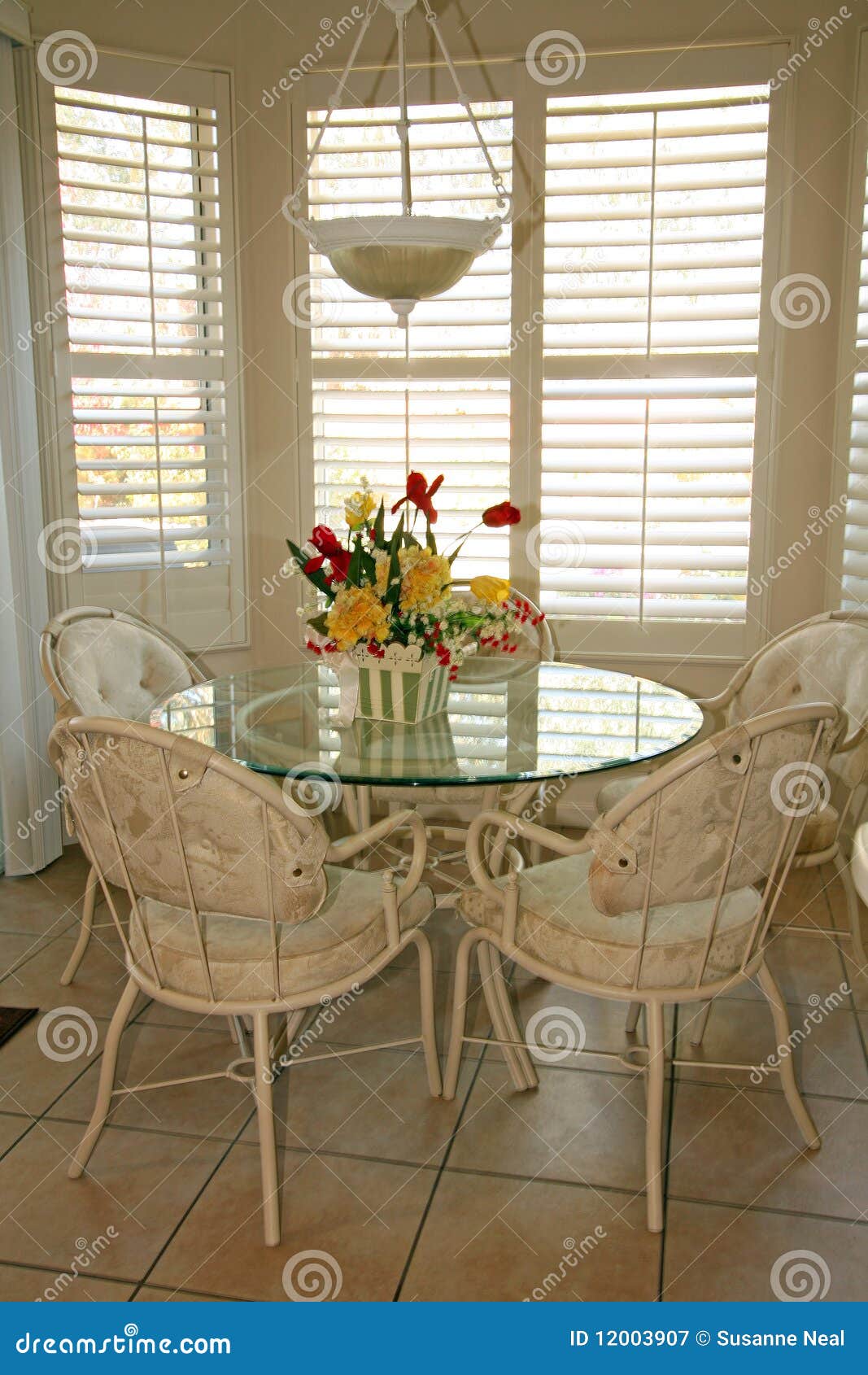 bright dining room with shutters