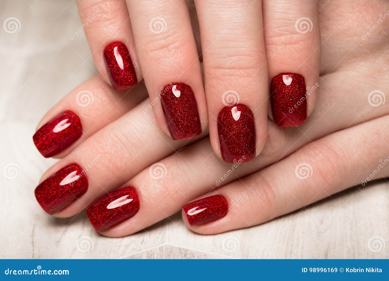 bright festive red manicure on female hands. nails 