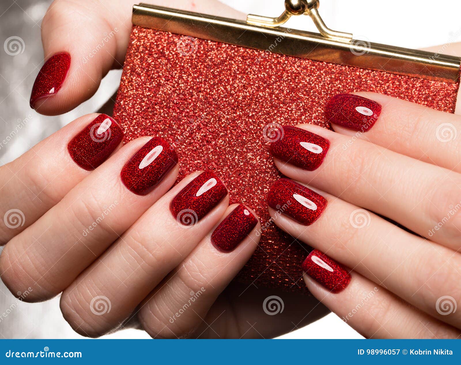 bright festive red manicure on female hands. nails 