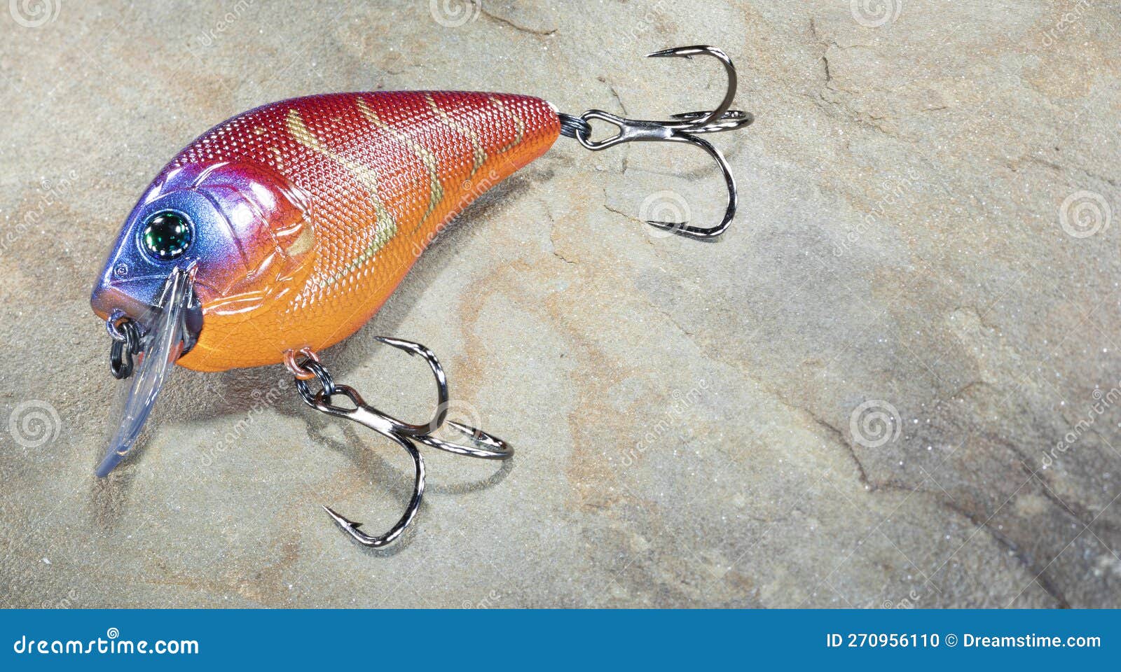 Bright Fishing Lure on a Rock Stock Photo - Image of leisure