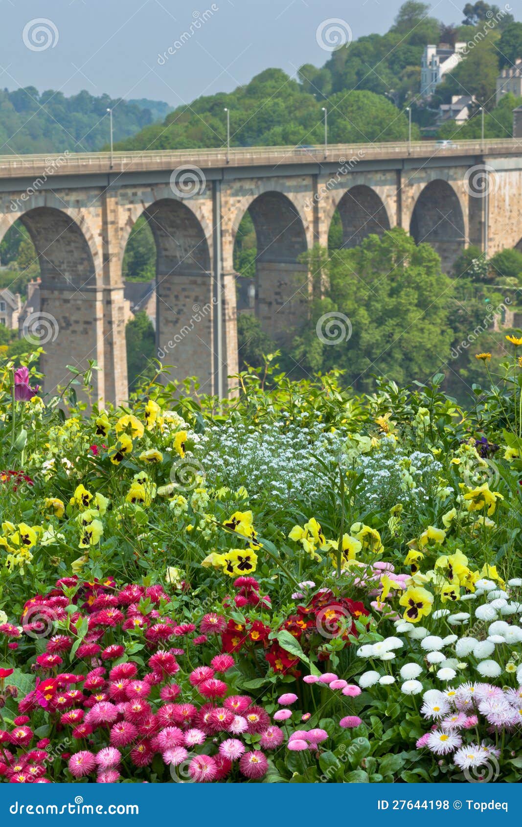 Bright Flowerbed and Tall Stone Bridge Stock Photo Image of purple