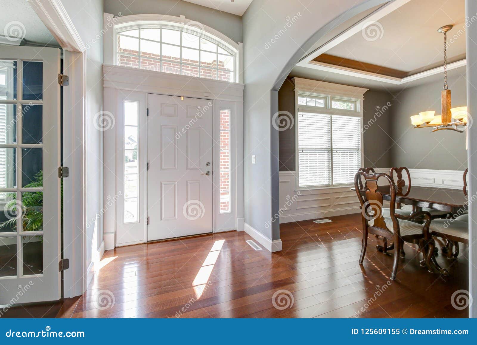 Bright Foyer With View Of Dining Room And Parlor Stock