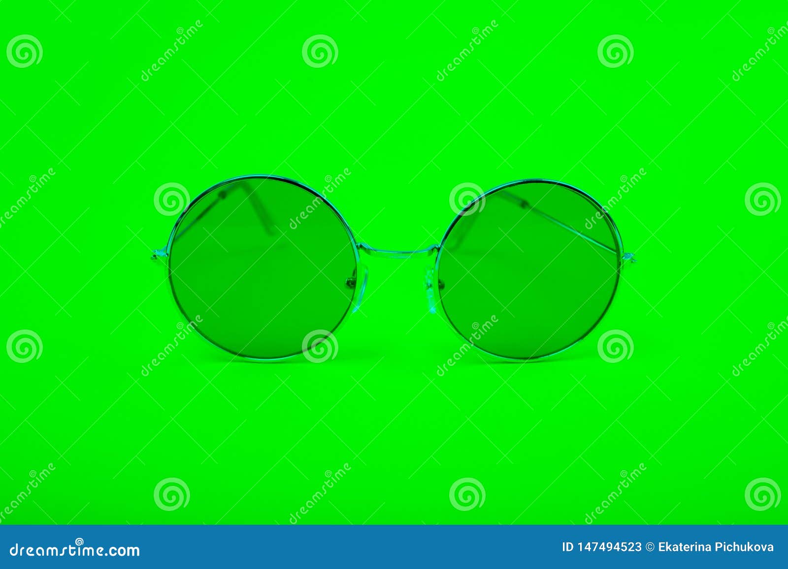 Bright Green Glasses on a Green Background Stock Image - Image of