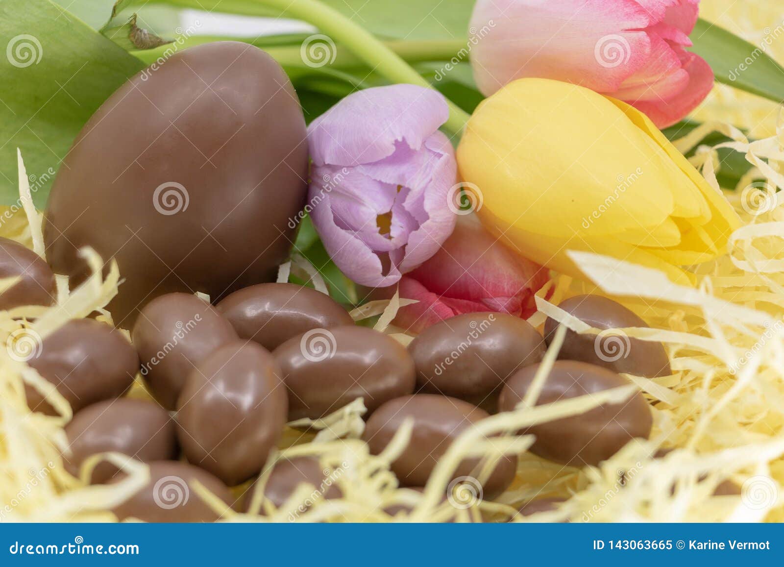 Easter with Soft Colors and Pastel with Chocolate Eggs and Tulips Stock