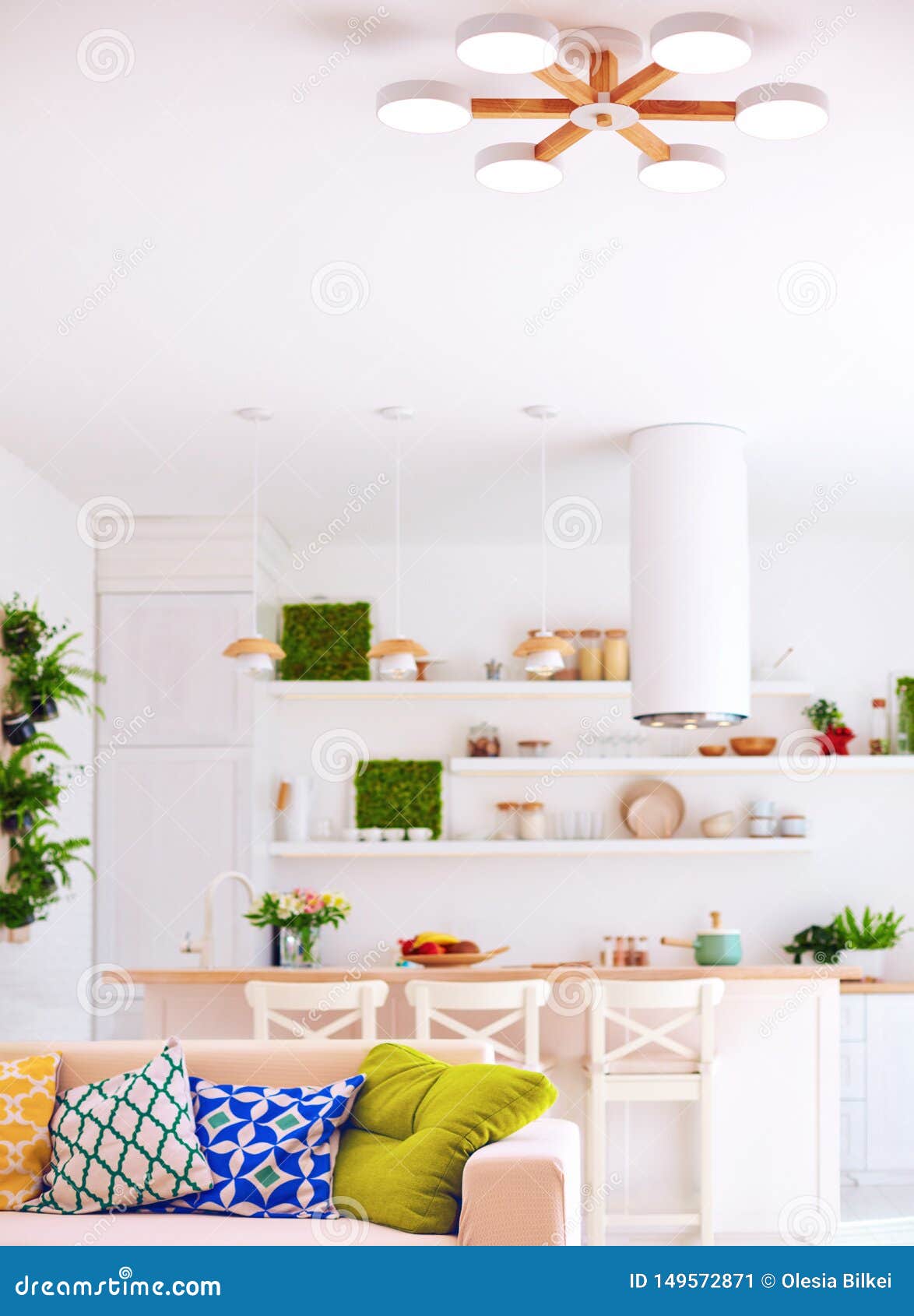 Bright Interior Of Living Room With Kitchen Island Sofa And Wall