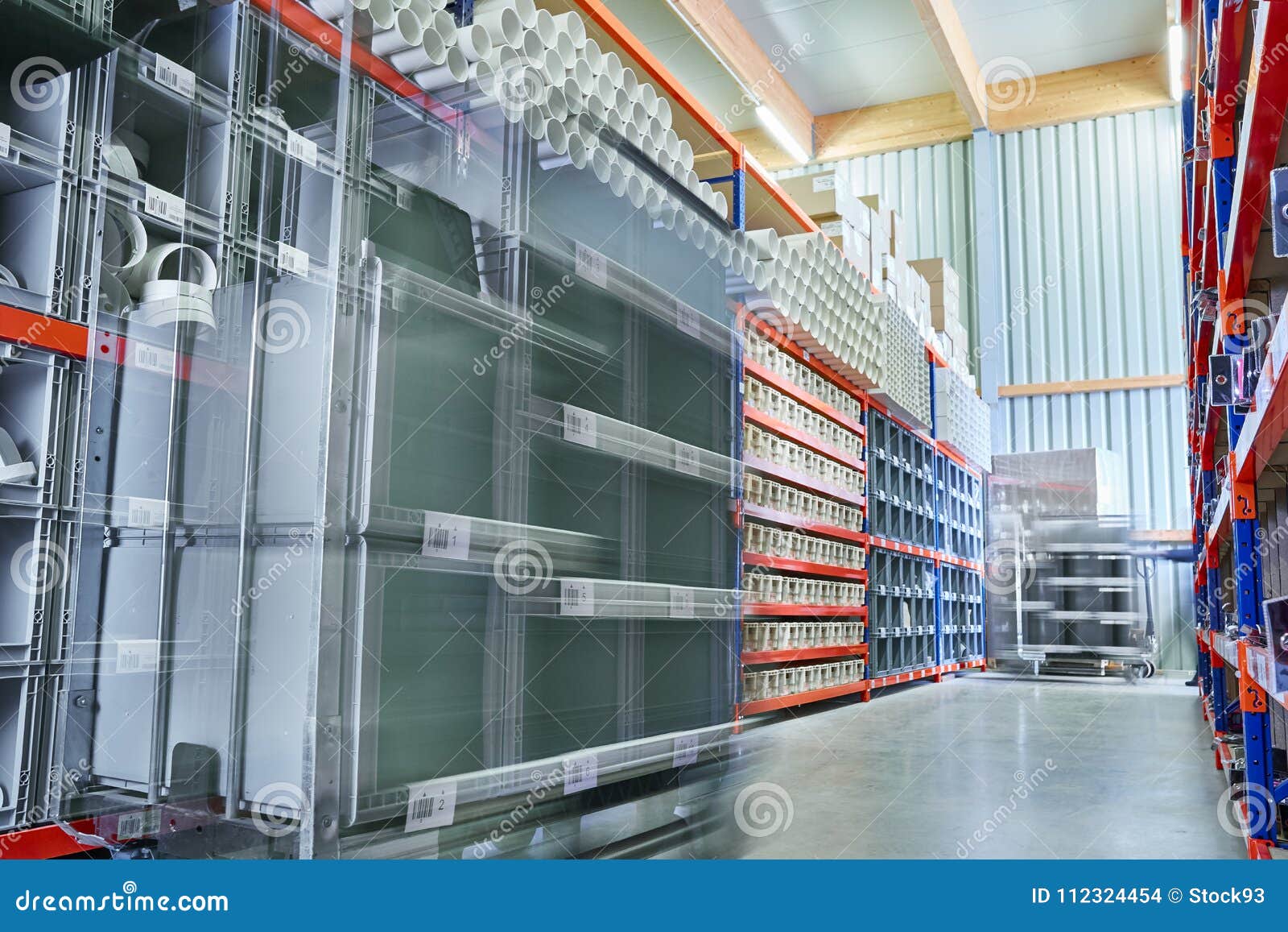 bright modern warehouse storage with workers commissioning in motion bluer
