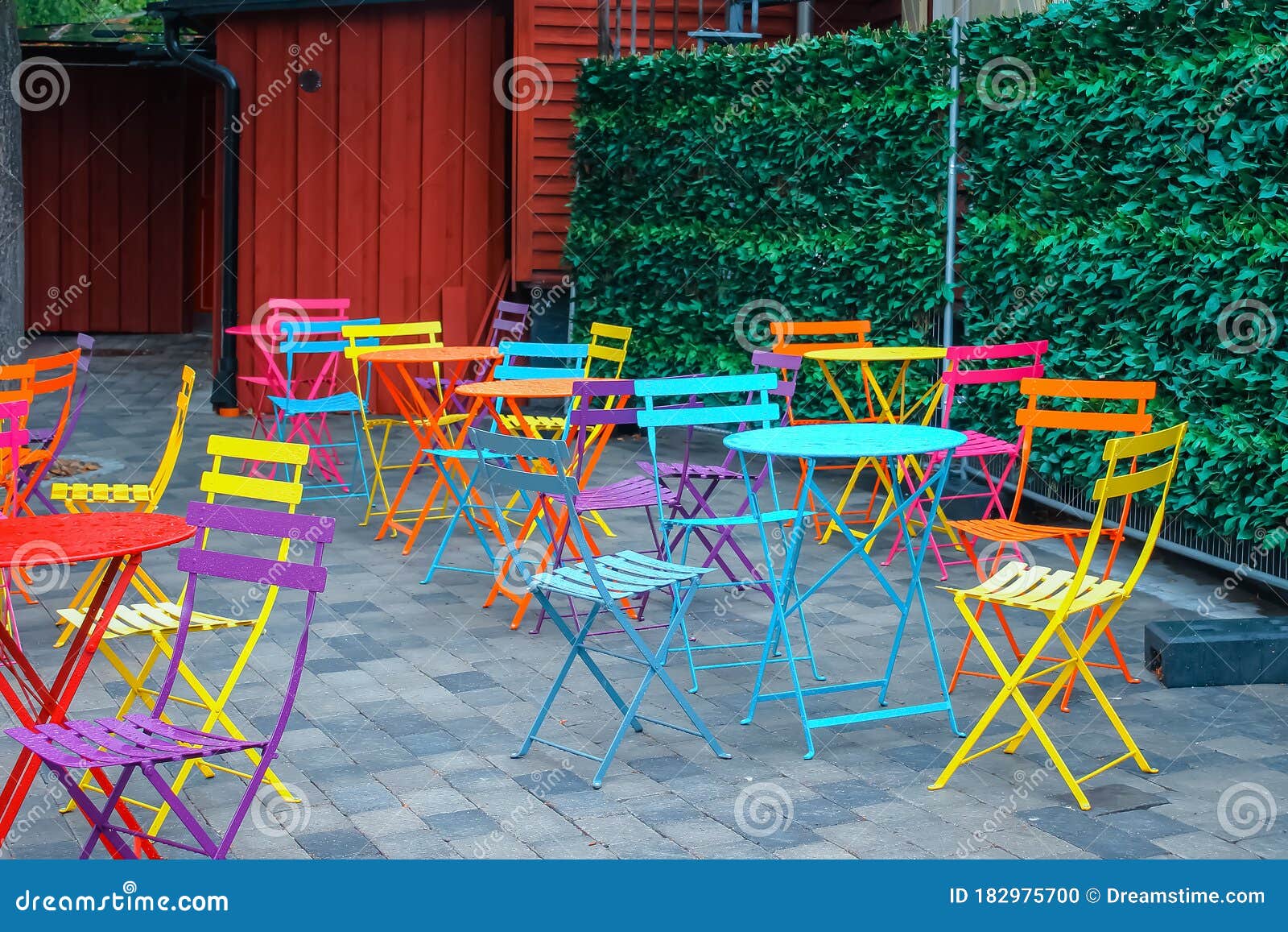 Bright Multicolored Chairs and Tables on the Terrace of an Outdoor