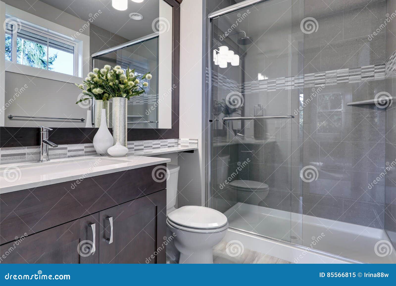 bright new bathroom interior with glass walk in shower