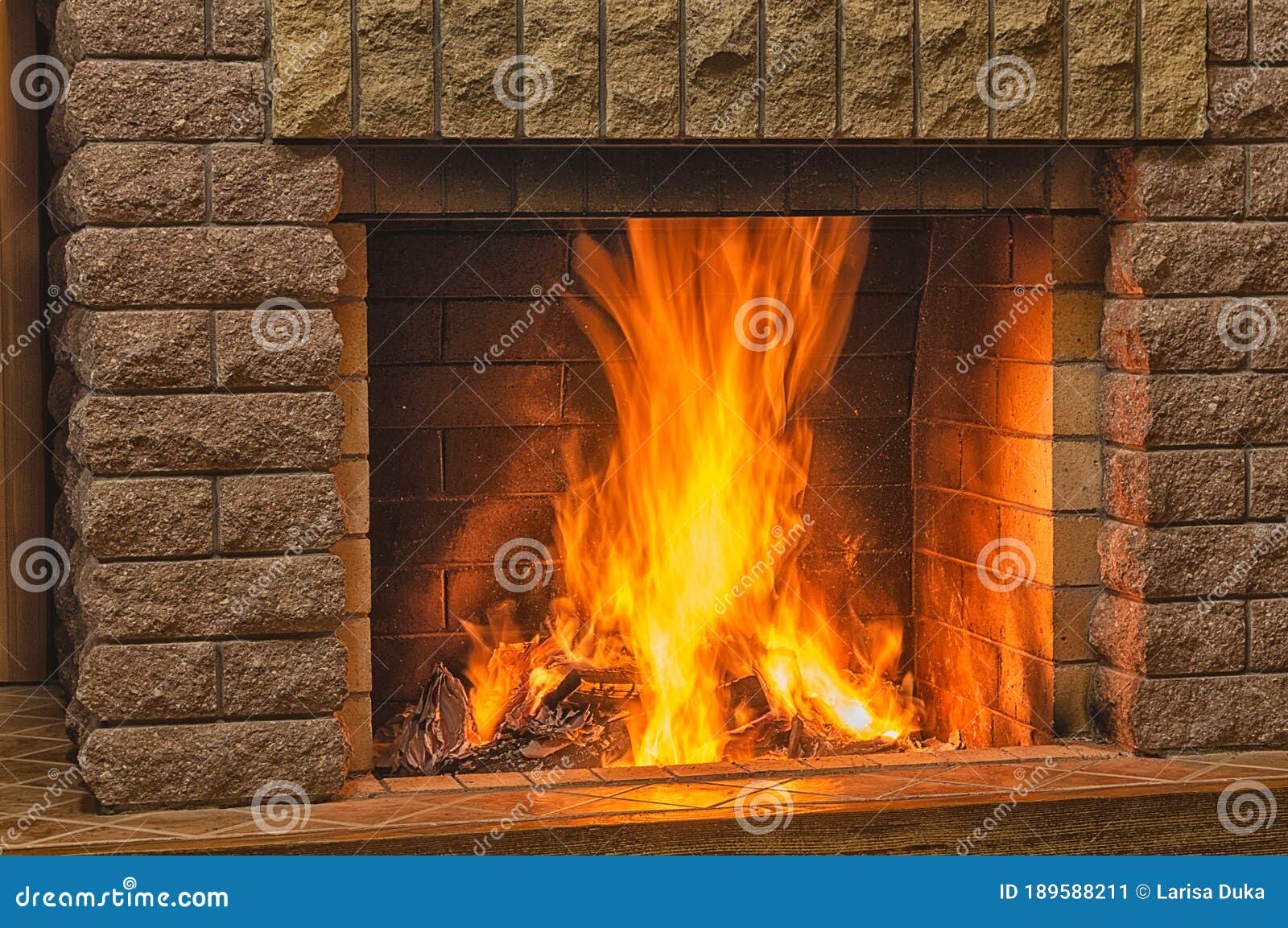 Bright Orange Fire in a Burning before Cozy Fireplace Stock Image