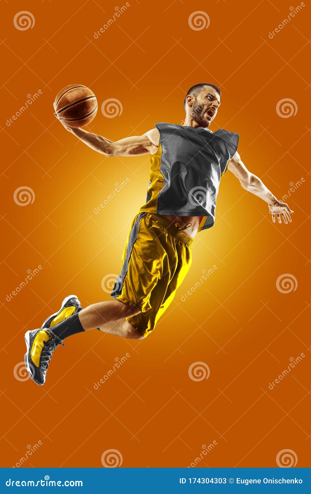 Bright Professional Basketball Player on an Orange Background Stock