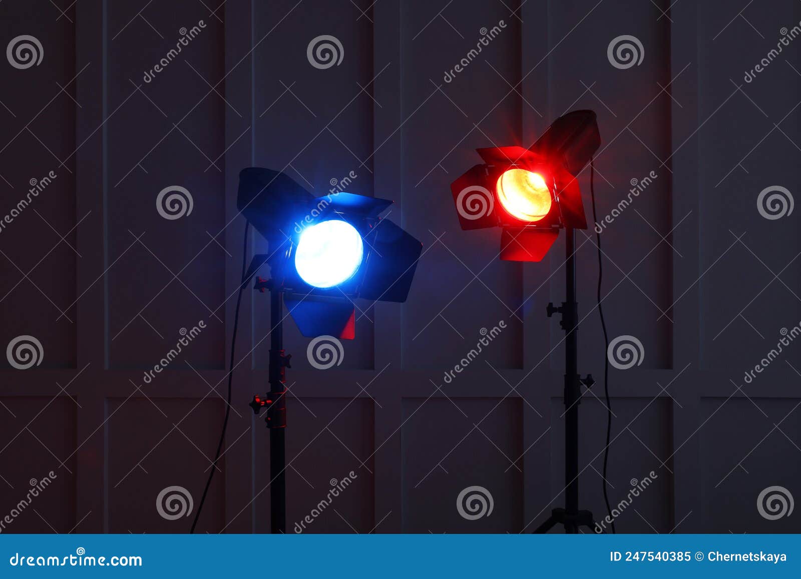 Bright Red and Blue Spotlights Near Wall in Dark Room Stock Image