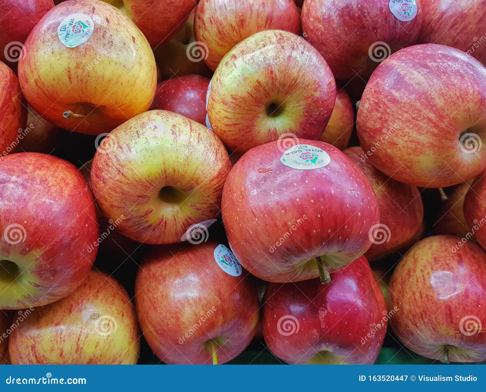 Bright Red and Fresh Apples with Supermarket Labels Editorial