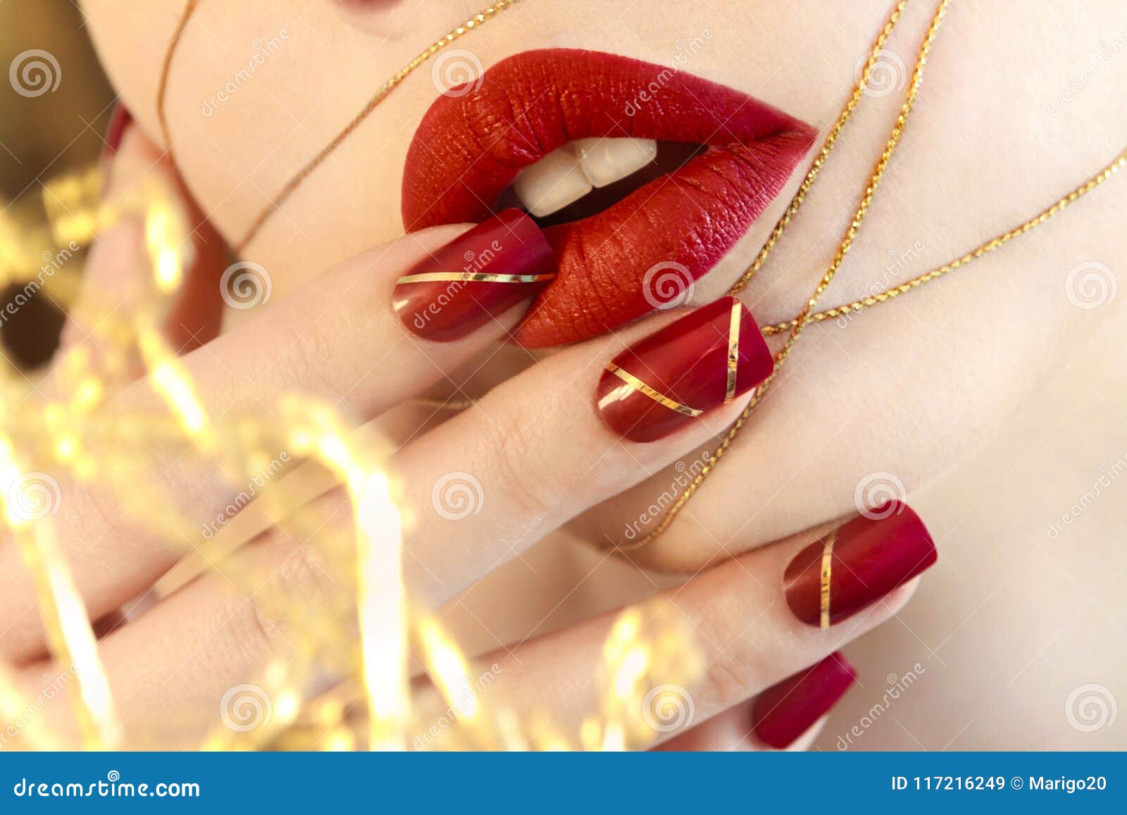 bright red manicure with a  on nails