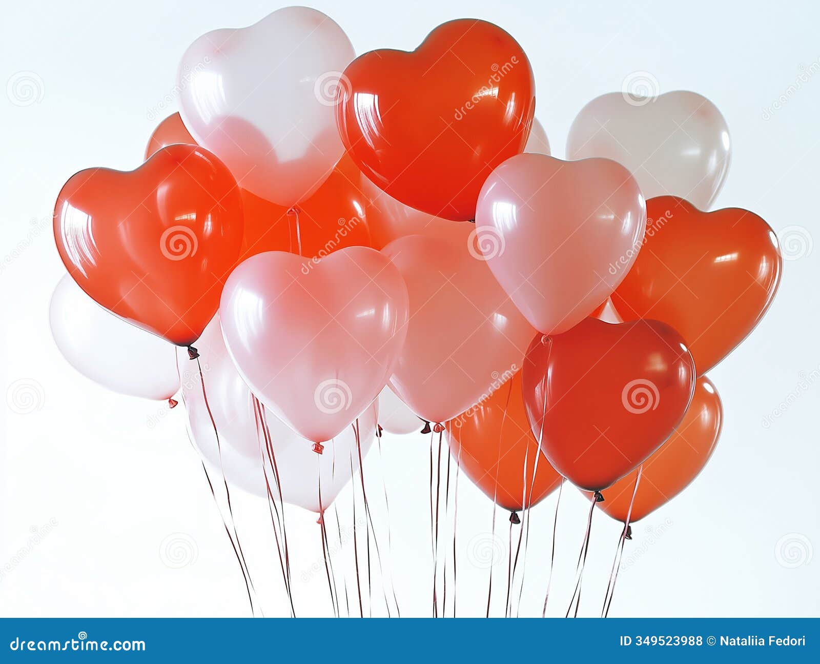 bright red and pink heart-d balloons floating against a clean white background