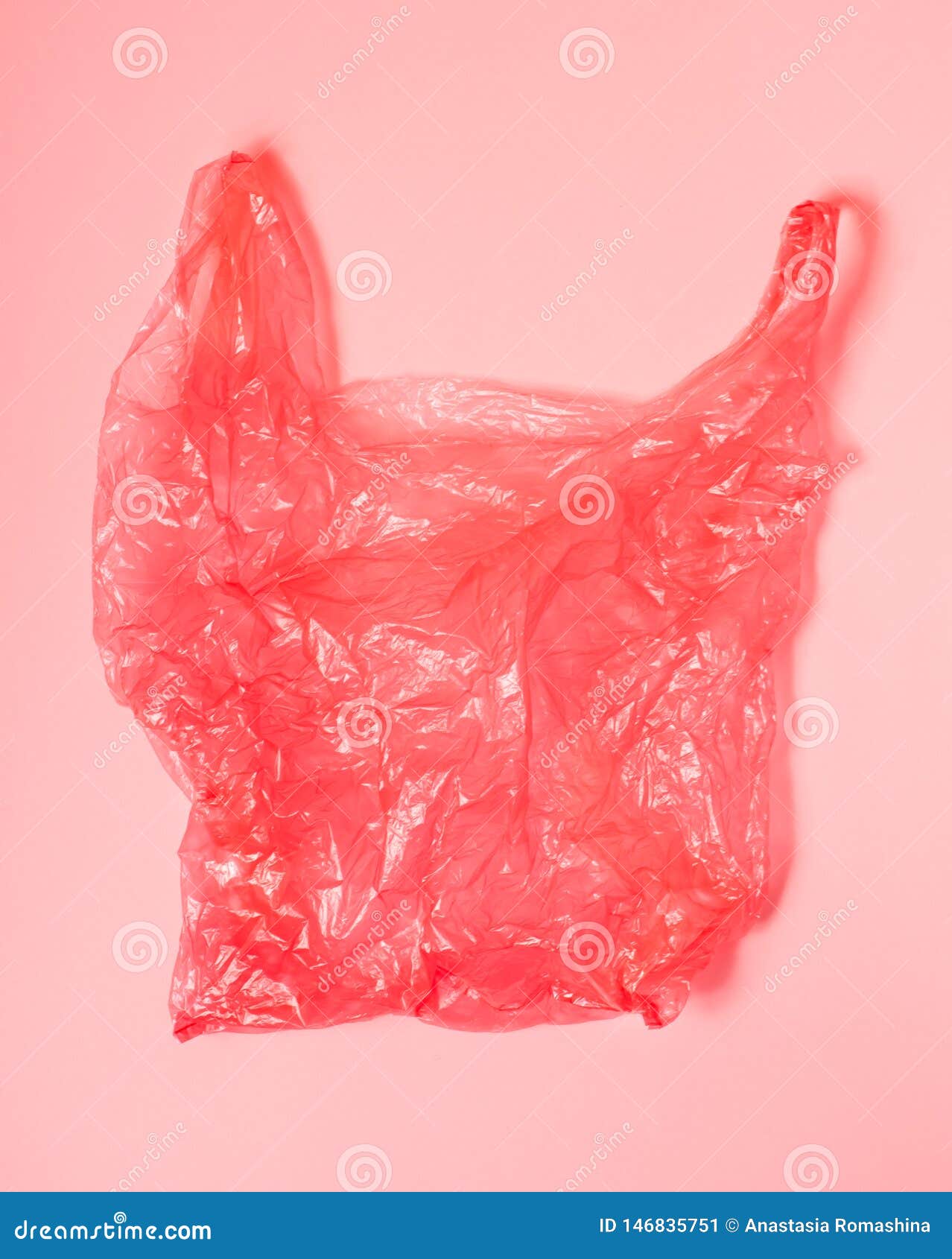 Bright Red Plastic Bag on Light Red Background. Stock Image - Image of