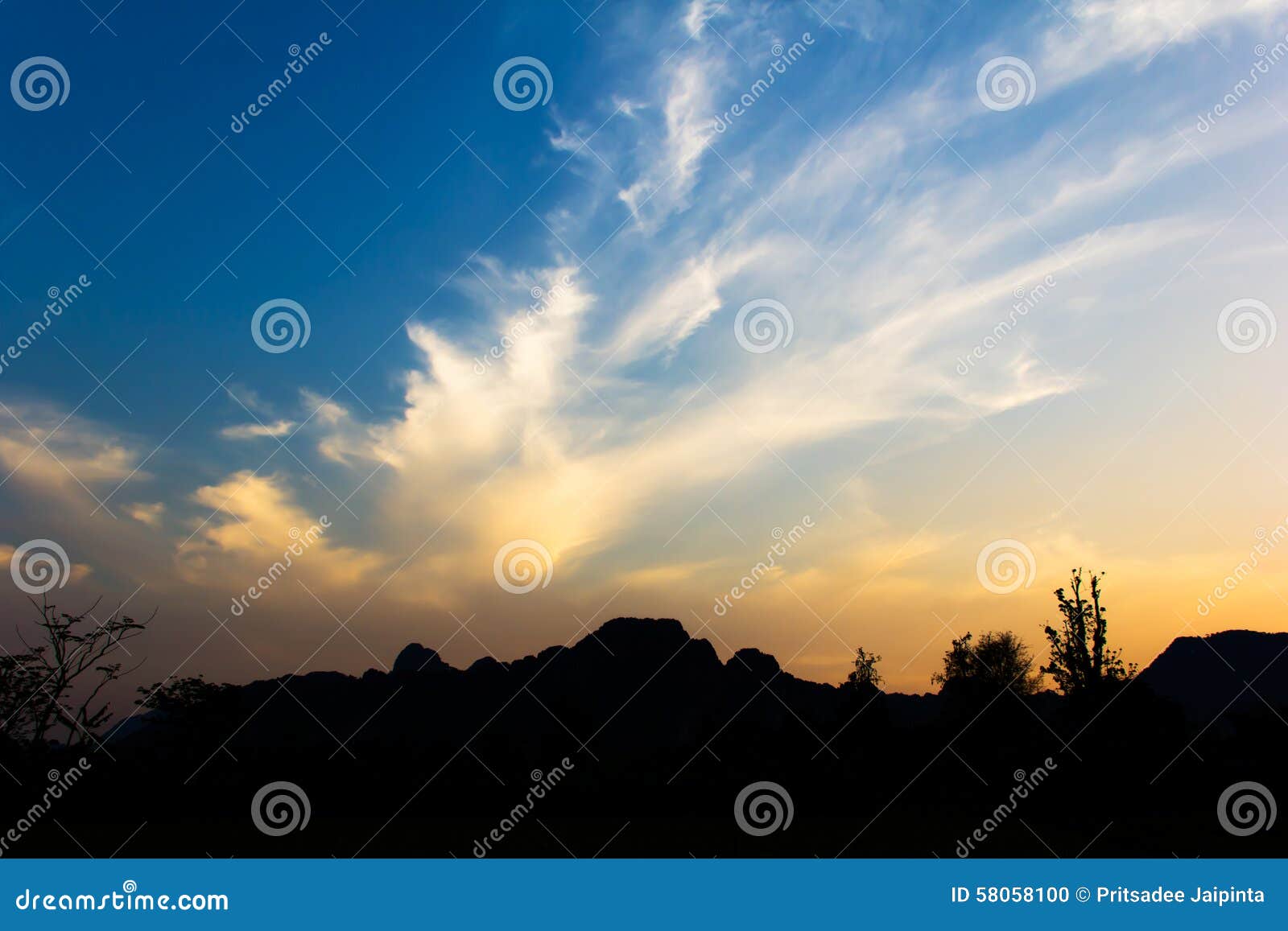 Bright sunset in sky over Vang Vieng landscape, LAOS.