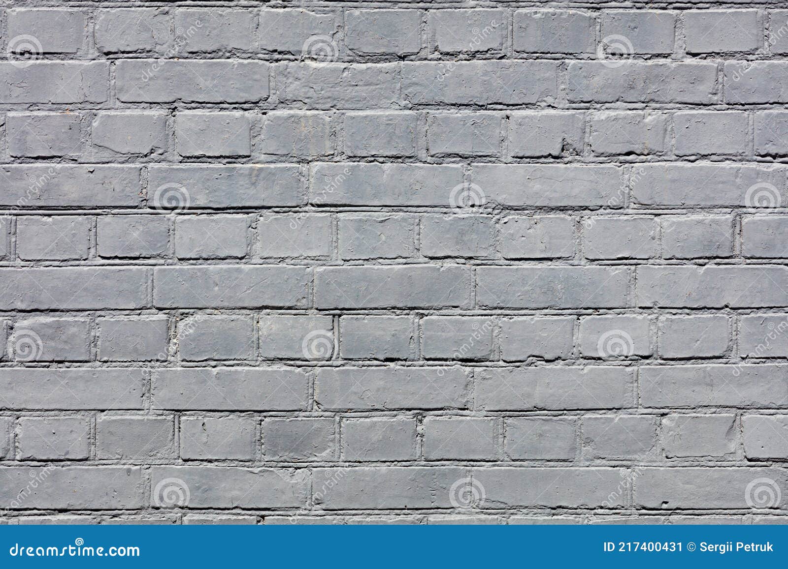 A Very Old Brick Wall Completely Painted with Gray Paint Stock Image